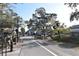 Vibrant streetscape with a 'Dunedin' sign, showcasing a pedestrian-friendly area with shops and businesses at 1276 Bermuda St, Clearwater, FL 33755
