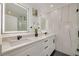 Modern bathroom with double vanity, quartz countertop, and a walk-in shower at 130 19Th St, Palm Harbor, FL 34683