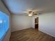 Bright bedroom with ceiling fan, and en suite bathroom at 13330 Ashbark Ct, Riverview, FL 33579