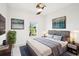 Serene bedroom showcasing modern decor, a plush bed, and picturesque window views at 18863 Roseate Dr, Lutz, FL 33558
