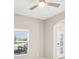 Bright living room featuring natural light, neutral paint, archways, and an ornate front door at 18863 Roseate Dr, Lutz, FL 33558