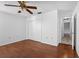 Bedroom with hardwood floors and ceiling fan at 2050 Glenridge Dr, Spring Hill, FL 34609