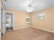 Bright bedroom featuring carpet, window, and ceiling fan at 2050 Glenridge Dr, Spring Hill, FL 34609