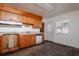 Traditional kitchen with wood cabinets, white countertops, and stainless steel sink, ready for renovation at 206 N Highland Ave, Clearwater, FL 33755