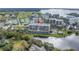 An aerial view showcases the condominium, with its water and golf course views at 220 Belleview Blvd # 108, Belleair, FL 33756