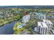 An aerial view shows the neighborhood, water features, and lush landscaping at 220 Belleview Blvd # 108, Belleair, FL 33756