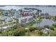 Aerial view of building shows beautiful water views, pool, and grounds at 220 Belleview Blvd # 108, Belleair, FL 33756