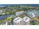 A high vantage shows the building's placement between the bay and a neighborhood at 220 Belleview Blvd # 108, Belleair, FL 33756