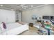 Inviting bedroom featuring wood floors, a ceiling fan, and a built-in closet at 220 Belleview Blvd # 108, Belleair, FL 33756