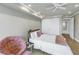 Cozy bedroom with a ceiling fan, wood floors, and closet at 220 Belleview Blvd # 108, Belleair, FL 33756