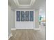 Stylish hallway closet with decorative glass doors, enhancing the entryway at 220 Belleview Blvd # 108, Belleair, FL 33756