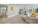 Bright living room with new floors, slider to patio, and recessed lighting at 220 Belleview Blvd # 108, Belleair, FL 33756