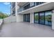 Large patio with ample space for outdoor seating and entertaining, offering a seamless indoor-outdoor living experience at 220 Belleview Blvd # 108, Belleair, FL 33756