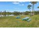 Community picnic area overlooking the lake includes picnic tables and charcoal grills at 220 Belleview Blvd # 108, Belleair, FL 33756