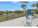 Picnic table and table with seating area overlooking the lake at 220 Belleview Blvd # 108, Belleair, FL 33756