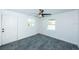 Simple bedroom with grey tile floors and ceiling fan at 2835 Freemont S Ter, St Petersburg, FL 33712