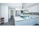 Modern kitchen with stainless steel appliances and white cabinets at 2835 Freemont S Ter, St Petersburg, FL 33712