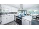 Modern kitchen features stainless steel appliances and white shaker cabinets at 2835 Freemont S Ter, St Petersburg, FL 33712