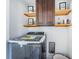 Modern laundry room with washer, dryer, and storage at 2835 Freemont S Ter, St Petersburg, FL 33712