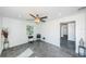 Spacious living room with ceiling fan and access to other rooms at 2835 Freemont S Ter, St Petersburg, FL 33712