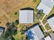 Birds eye view of a well maintained property featuring a light grey roof and well manicured landscaping at 301 Andover S Pl # 185, Sun City Center, FL 33573
