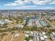 Expansive aerial view showcasing the community, landscaping, and lakes under a sunny sky at 301 Andover S Pl # 185, Sun City Center, FL 33573