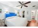 Cozy bedroom with a ceiling fan, closet, and bathroom access at 301 Andover S Pl # 185, Sun City Center, FL 33573