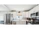 Stylish kitchen with stainless steel refrigerator, appliances, and sink at 301 Andover S Pl # 185, Sun City Center, FL 33573
