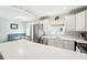 Eat-in kitchen features stainless steel appliances, blue accents and plenty of natural light at 301 Andover S Pl # 185, Sun City Center, FL 33573