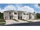 New townhome community with attached garages and landscaping at 31277 Midnight Sun Way, Wesley Chapel, FL 33545