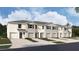 New townhome community with attached garages and landscaping at 31277 Midnight Sun Way, Wesley Chapel, FL 33545