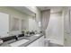 Double vanity bathroom with a large shower and modern fixtures at 31279 Midnight Sun Way, Wesley Chapel, FL 33545