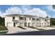 New townhome community with attached garages and landscaping at 31279 Midnight Sun Way, Wesley Chapel, FL 33545