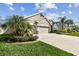 House exterior showcasing a three-car garage at 32397 Bannack Ln, Wesley Chapel, FL 33543