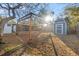 Sunny backyard with shed and wooden arbor at 345 Dr Ml King Jr N St, Safety Harbor, FL 34695