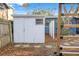 White shed with double doors in the backyard at 345 Dr Ml King Jr N St, Safety Harbor, FL 34695