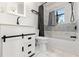 Updated bathroom, featuring a white vanity with barn door at 345 Dr Ml King Jr N St, Safety Harbor, FL 34695