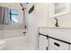 Updated bathroom with a white vanity, black fixtures, and patterned tile at 345 Dr Ml King Jr N St, Safety Harbor, FL 34695