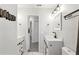 Modern bathroom with double vanity, updated fixtures, and a view of another room at 345 Dr Ml King Jr N St, Safety Harbor, FL 34695