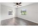 Well-lit bedroom with ceiling fan and hardwood floors at 345 Dr Ml King Jr N St, Safety Harbor, FL 34695