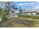 Front yard view shows the house and its well-maintained lawn at 345 Dr Ml King Jr N St, Safety Harbor, FL 34695