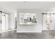 Open concept kitchen with white cabinets and a view of the living room at 345 Dr Ml King Jr N St, Safety Harbor, FL 34695