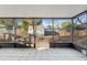 Spacious screened porch overlooking a backyard with shed and arbor at 345 Dr Ml King Jr N St, Safety Harbor, FL 34695