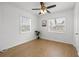 Well-lit bedroom featuring wood-look floors and a ceiling fan at 3645 5Th S Ave, St Petersburg, FL 33711