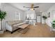 Bright living room with light beige couch and wood floors at 3645 5Th S Ave, St Petersburg, FL 33711