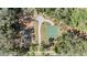 Aerial view of a playground with swings, benches, a basketball court, and lush landscaping at 3900 Claybrook Dr, Wesley Chapel, FL 33544