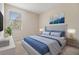 A bedroom with a large window provides natural light on the comfy bed at 3900 Claybrook Dr, Wesley Chapel, FL 33544