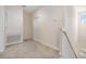 A carpeted hallway with a staircase and a closet at 3900 Claybrook Dr, Wesley Chapel, FL 33544
