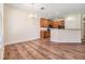 An open kitchen and dining area features wood cabinets and a breakfast bar at 3900 Claybrook Dr, Wesley Chapel, FL 33544