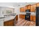 Well-equipped kitchen boasts wood cabinets and stainless steel appliances at 3900 Claybrook Dr, Wesley Chapel, FL 33544